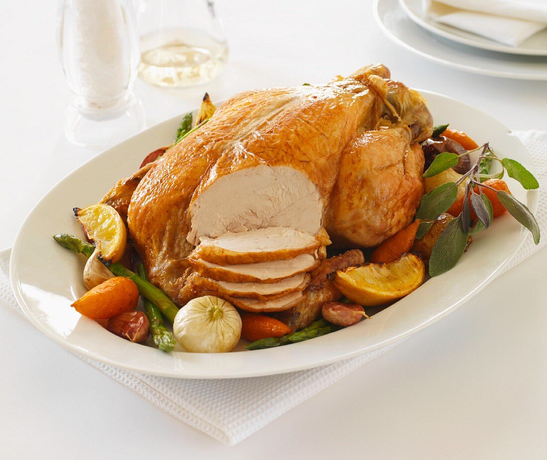 Roast chicken with vegetables, partly sliced