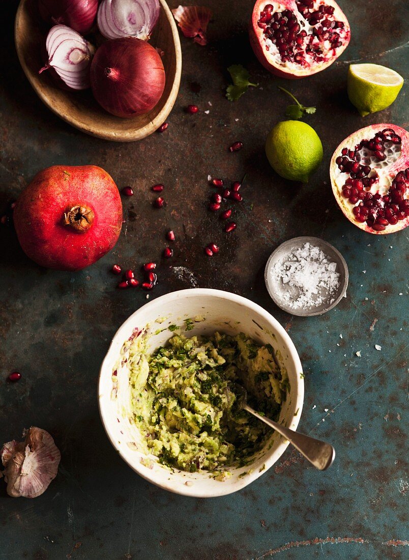 Guacamole, salt, pomegranate, onions and limes