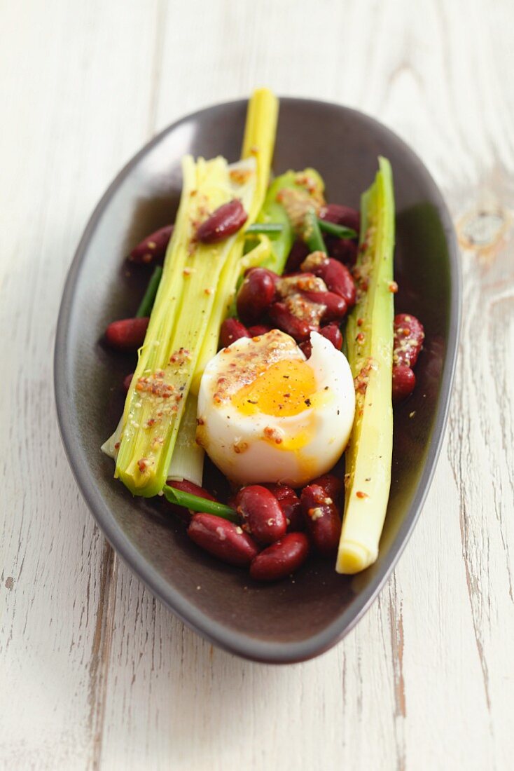 Kidney bean salad with leek, soft-boiled egg and mustard dressing