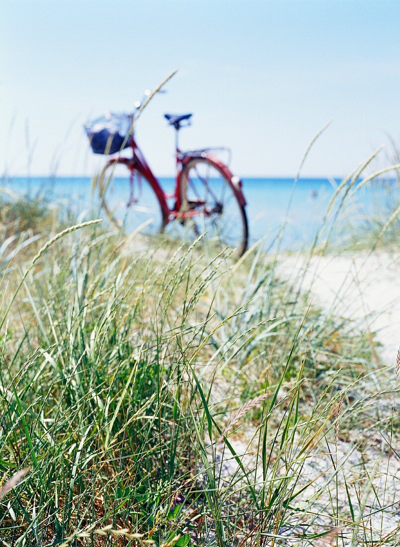 A bicycle on a beach.