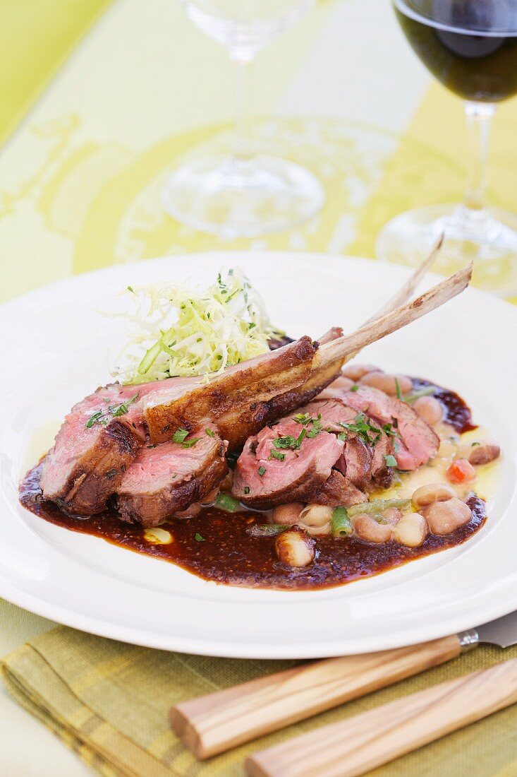 Lamb chops on beans with a red wine sauce