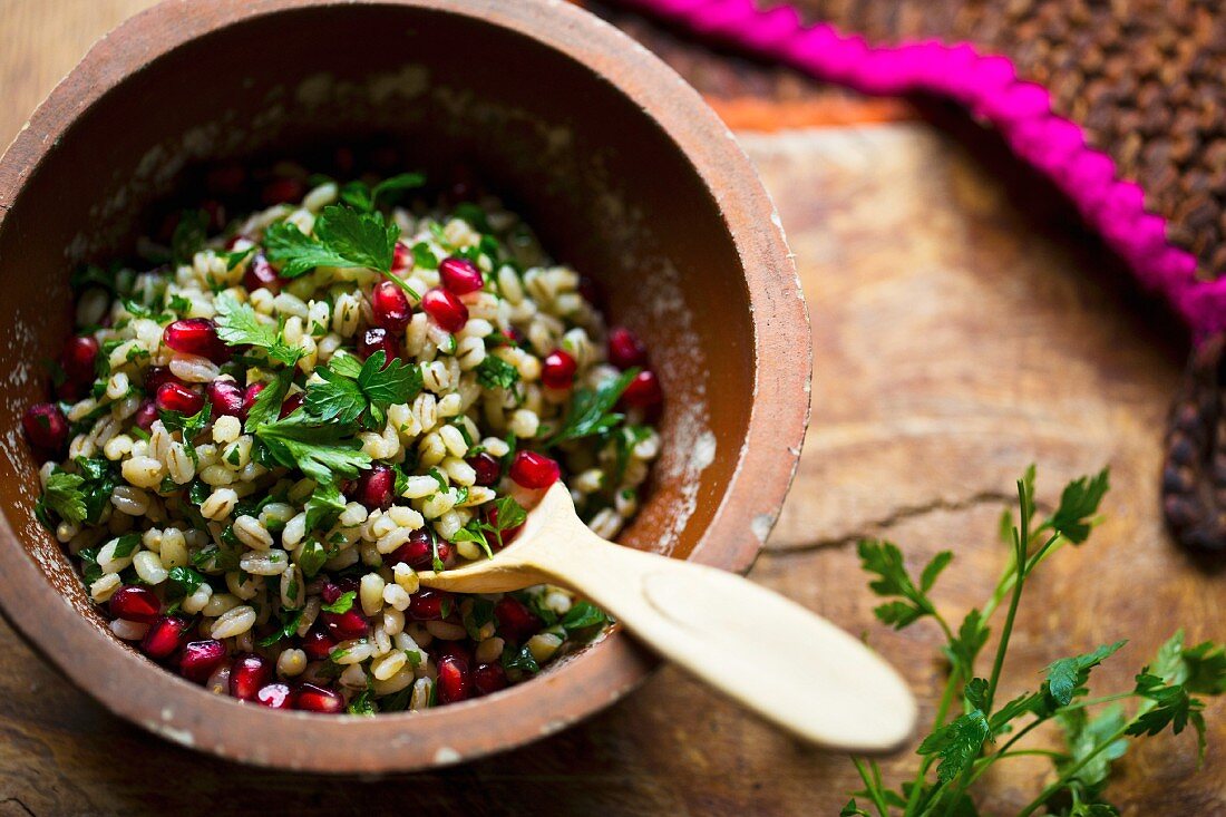 Pearl barley salad with pomegranate with parsley