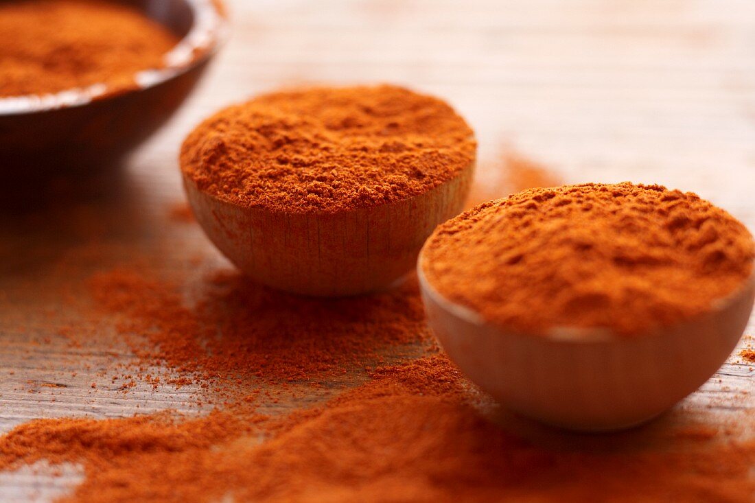 Paprika in small wooden bowls