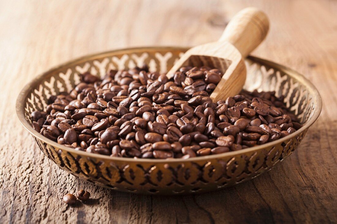Coffee beans in metal bowl