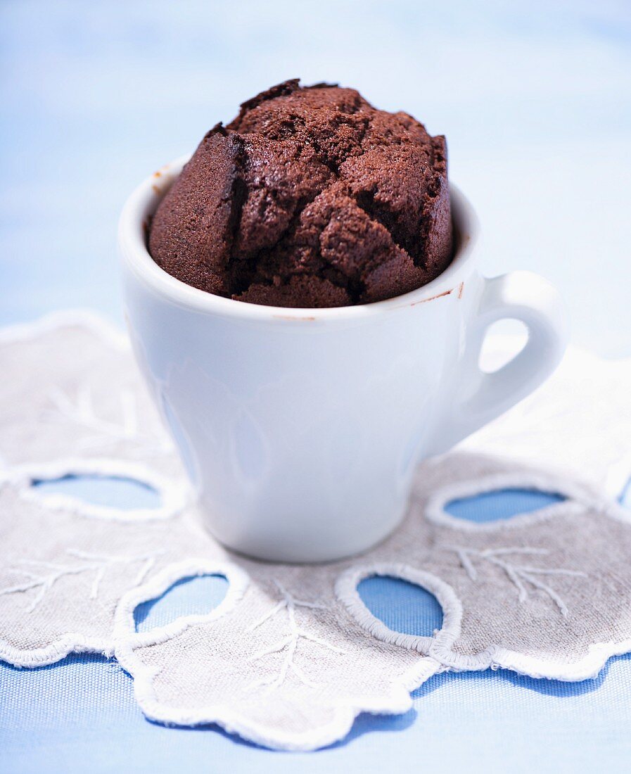 A chocolate muffin in an espresso cup