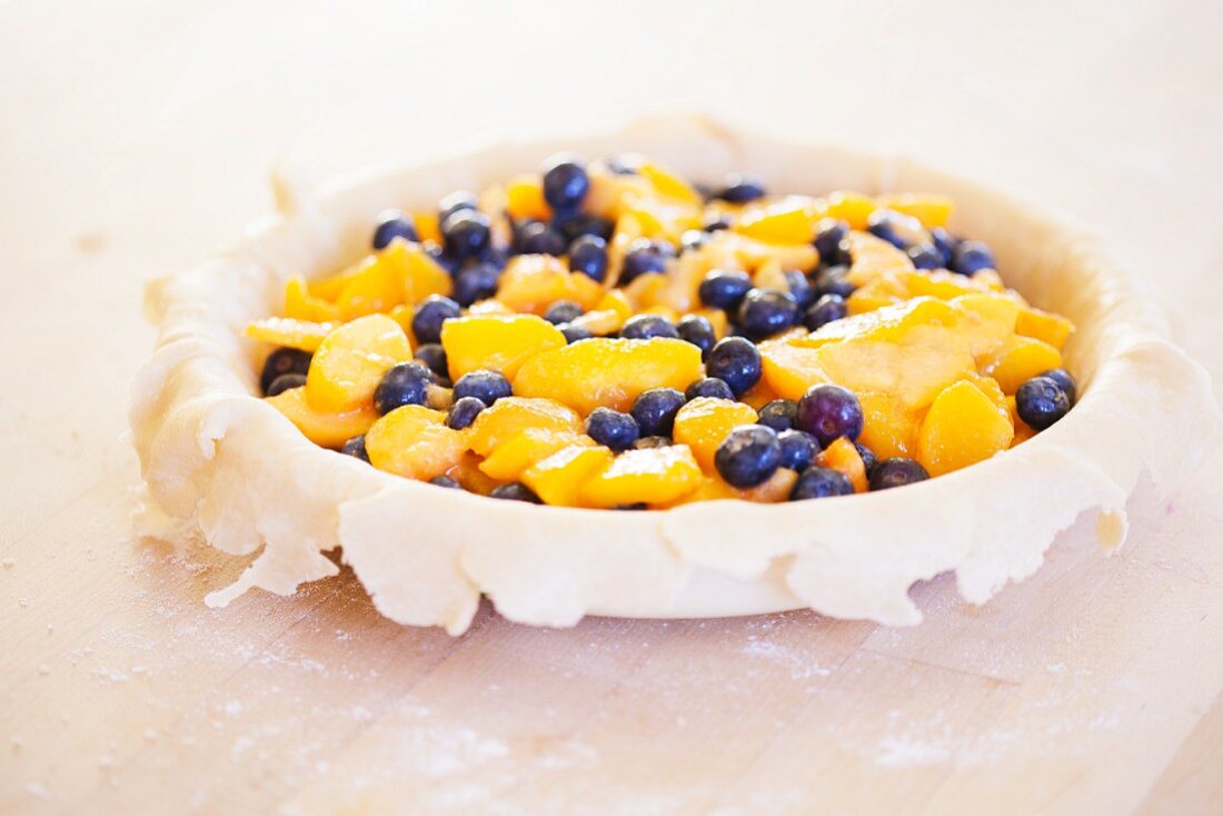 Making a Blueberry and Peach Pie