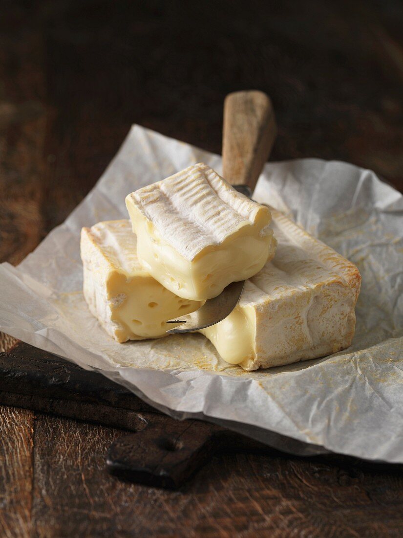 Still life with slice of pont l eveque cheese