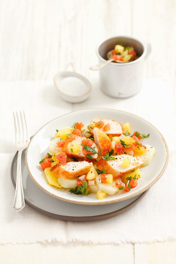 Potato salad with chicken breast and tomato salsa