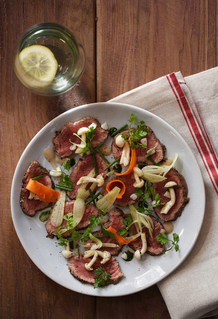 Carpaccio of springbok with shimeji mushrooms, fennel and carrots