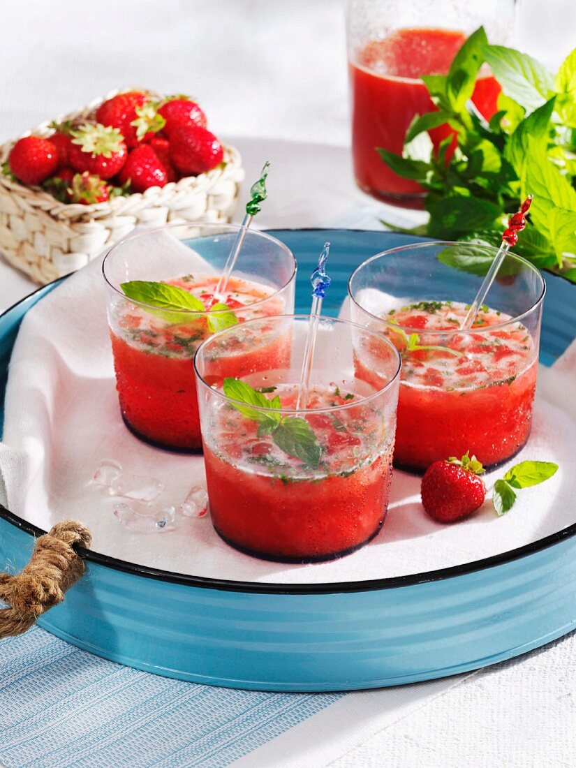 Strawberry drinks with mint and lime