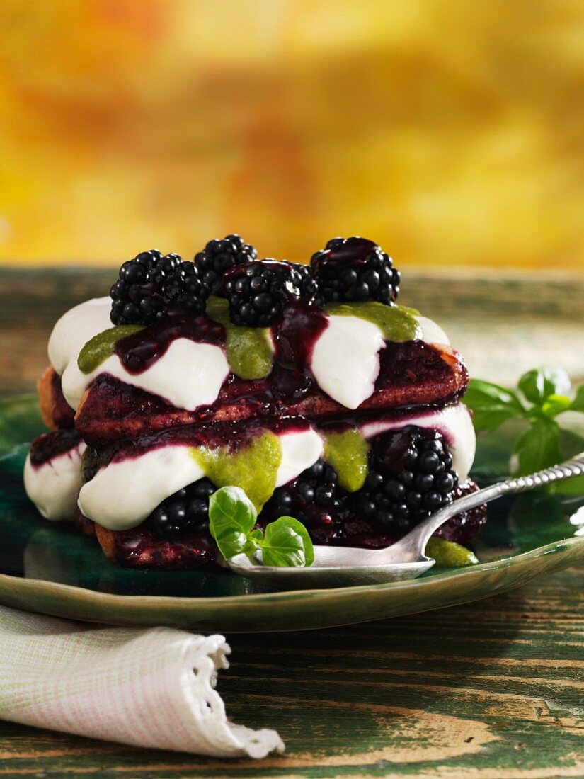 Blackberry tiramisu with cream and basil