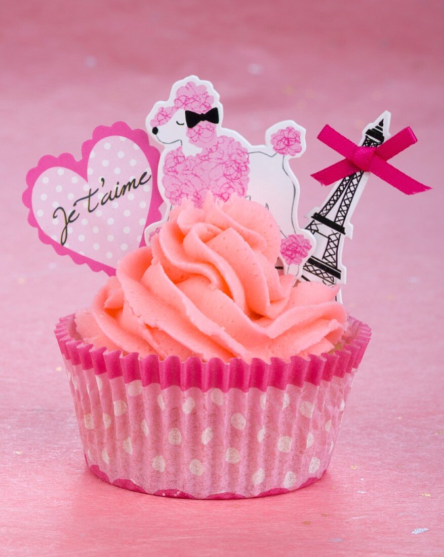 A pink cupcake with romantic decoration for Valentine's Day