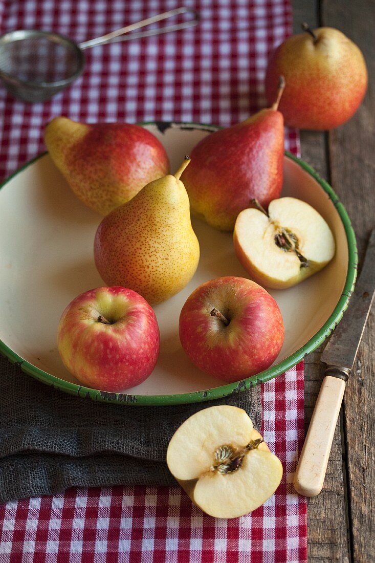 Apples and pears in an old bowl