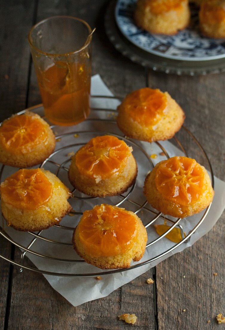 Mini upside-down clementine cakes on a wire rack