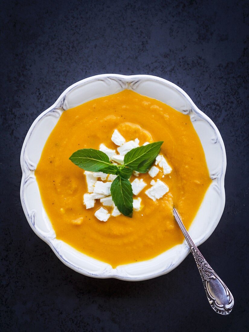 Cream squash soup served with feta cheese.