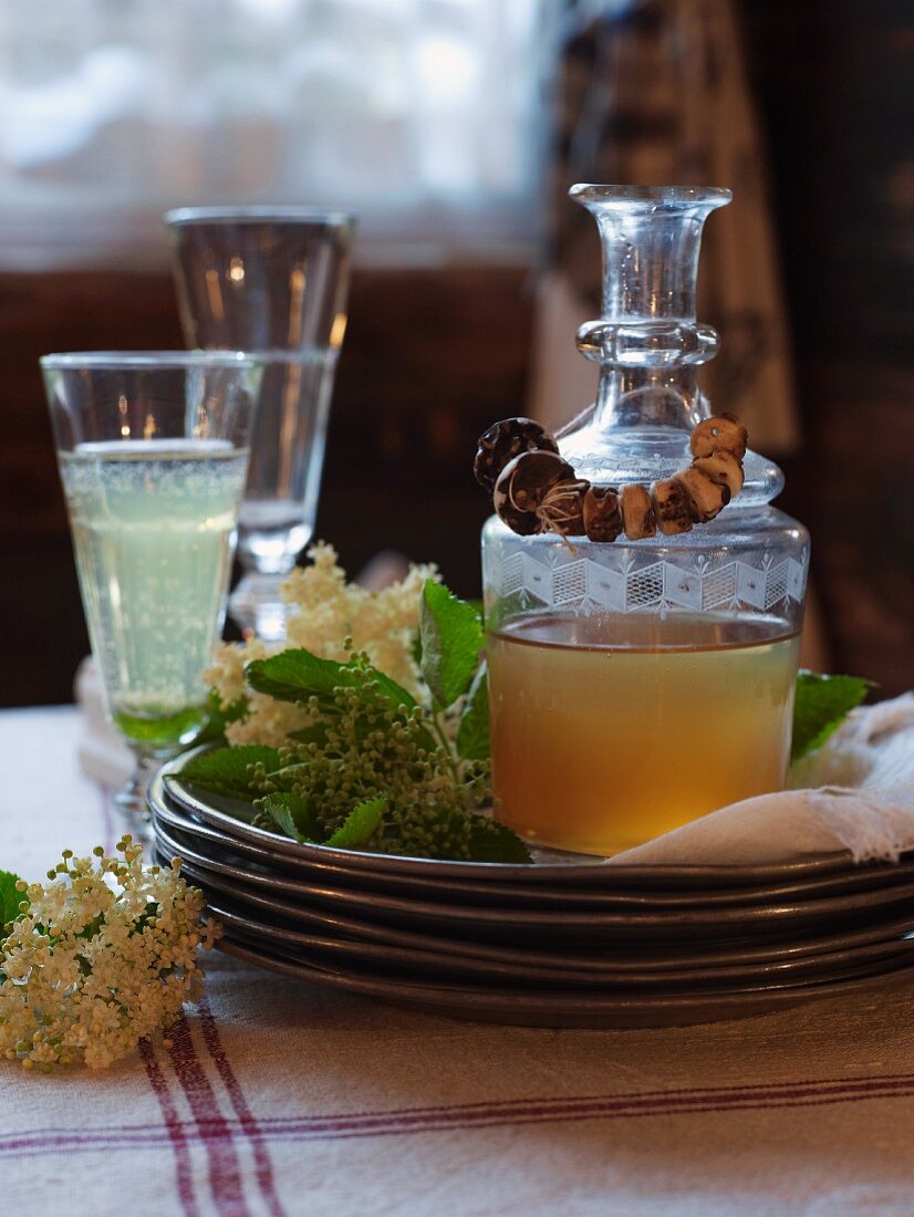 A carafe of elderflower syrup