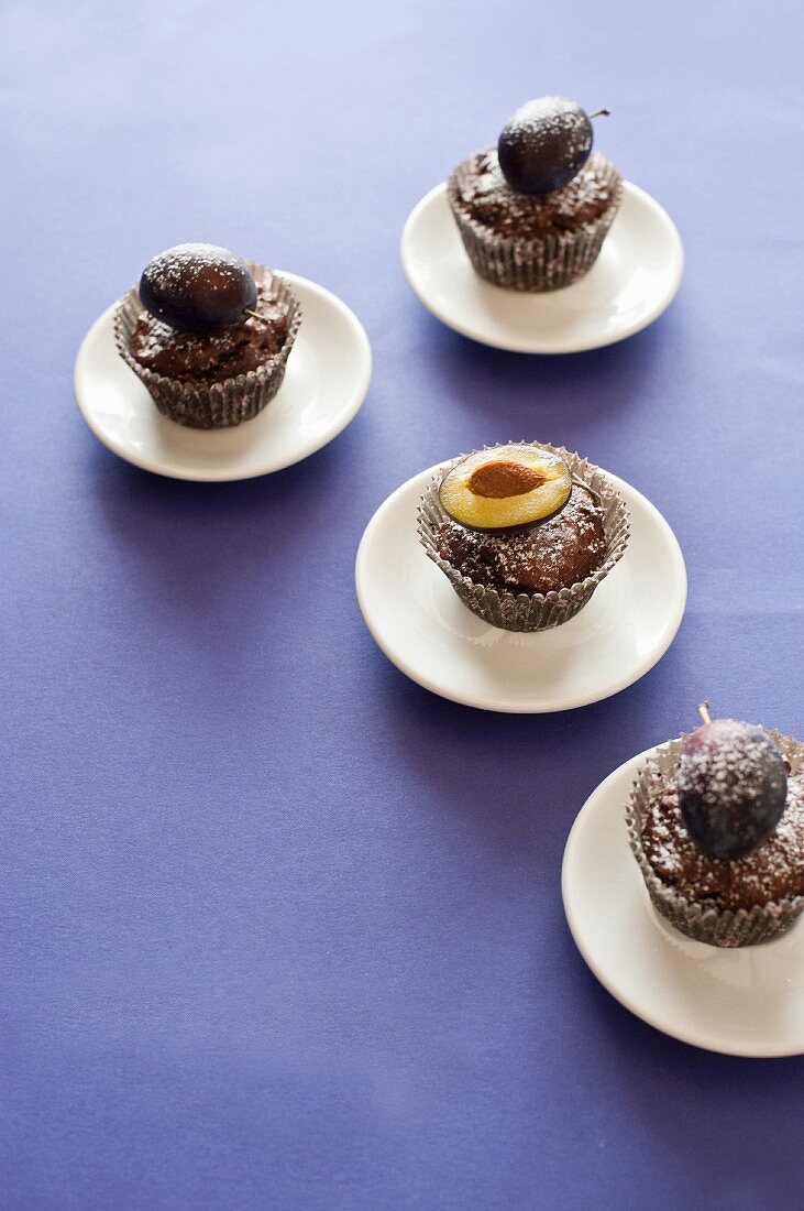 Chocolate muffins with fresh plums