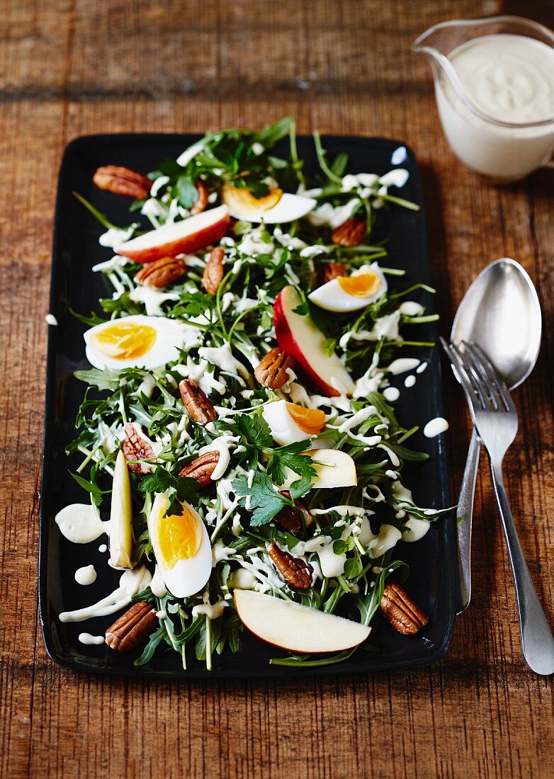 Rocket salad with apple wedges and boiled eggs