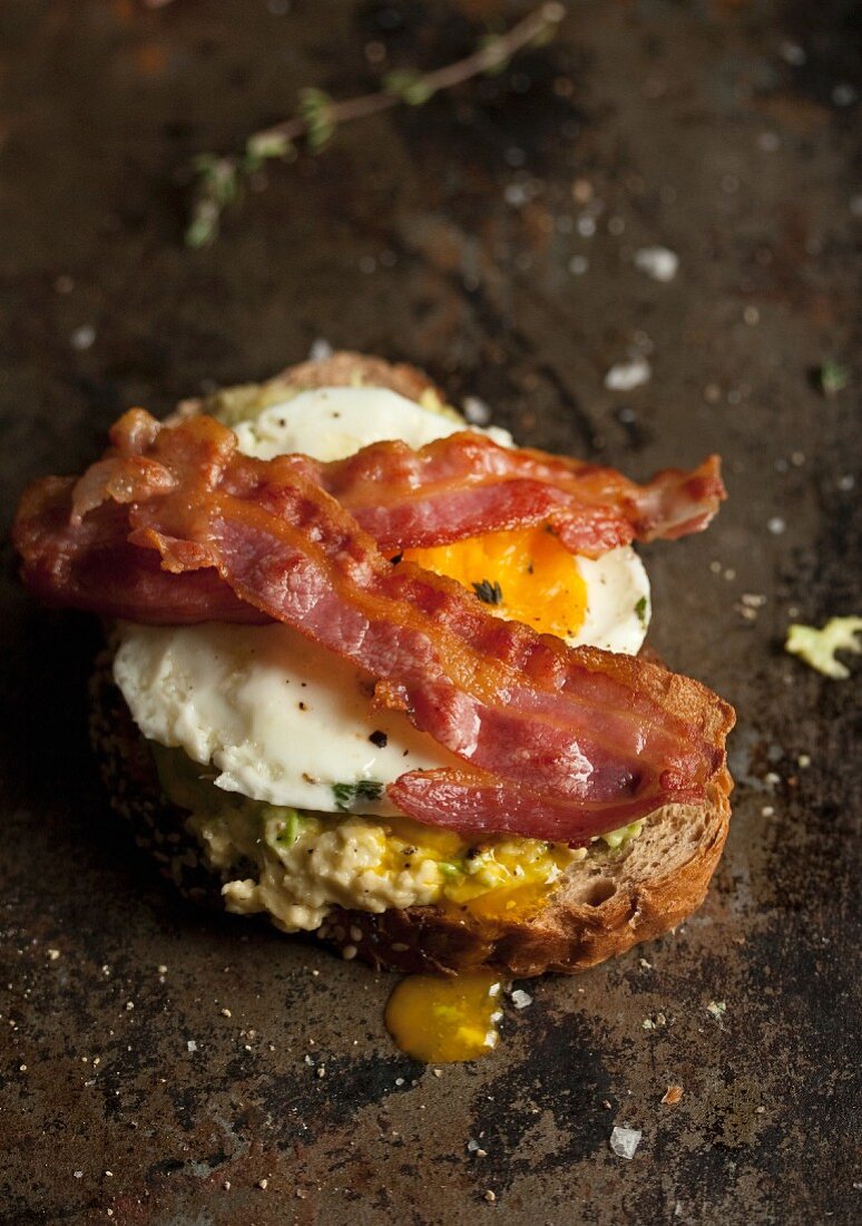 Fried egg and bacon on toast