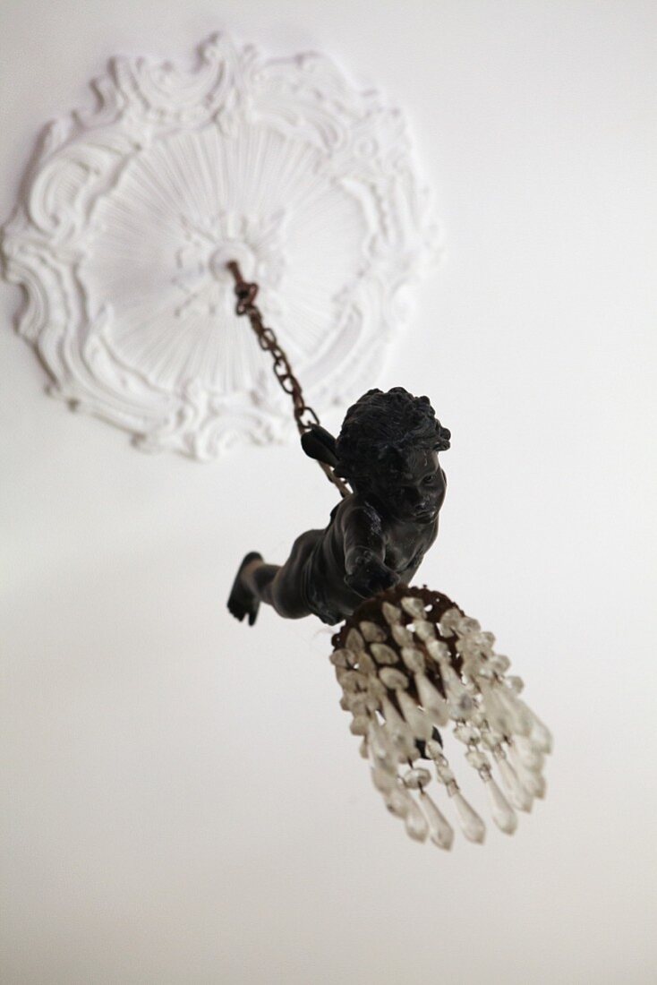 Pendant lamp with glass beads and cherub figurine