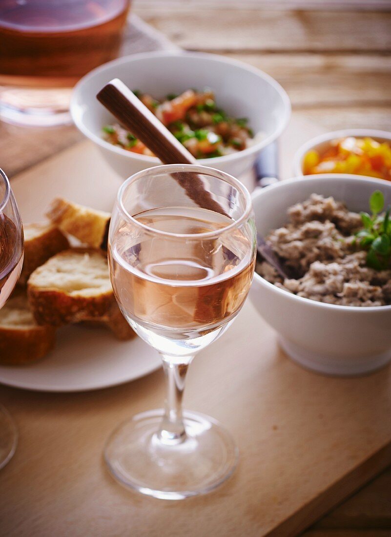 Sardine mousse with bread and rosé wine