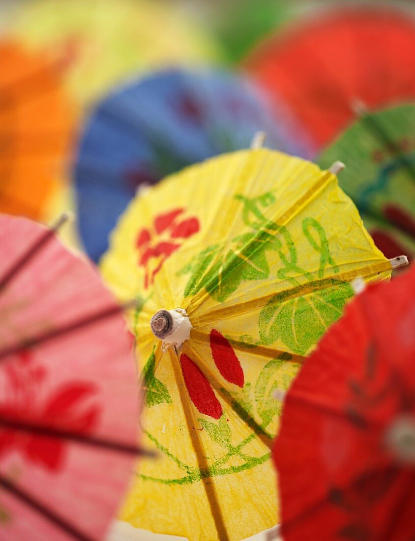 Several colourful cocktail umbrellas (close-up)