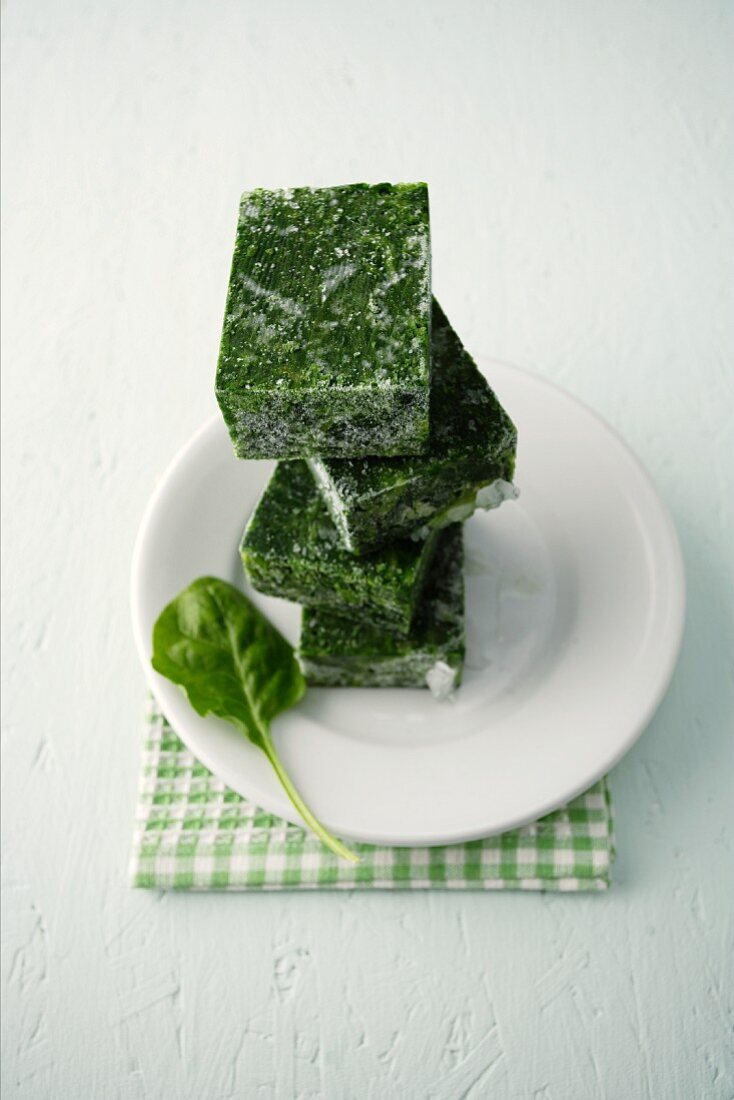 Frozen cubes of spinach, stacked