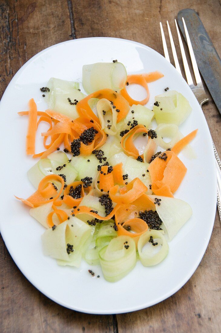Carrot salad with cucumber and mustard seeds