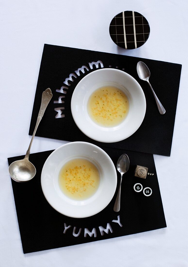 Black, felt place mats with cut-out letters