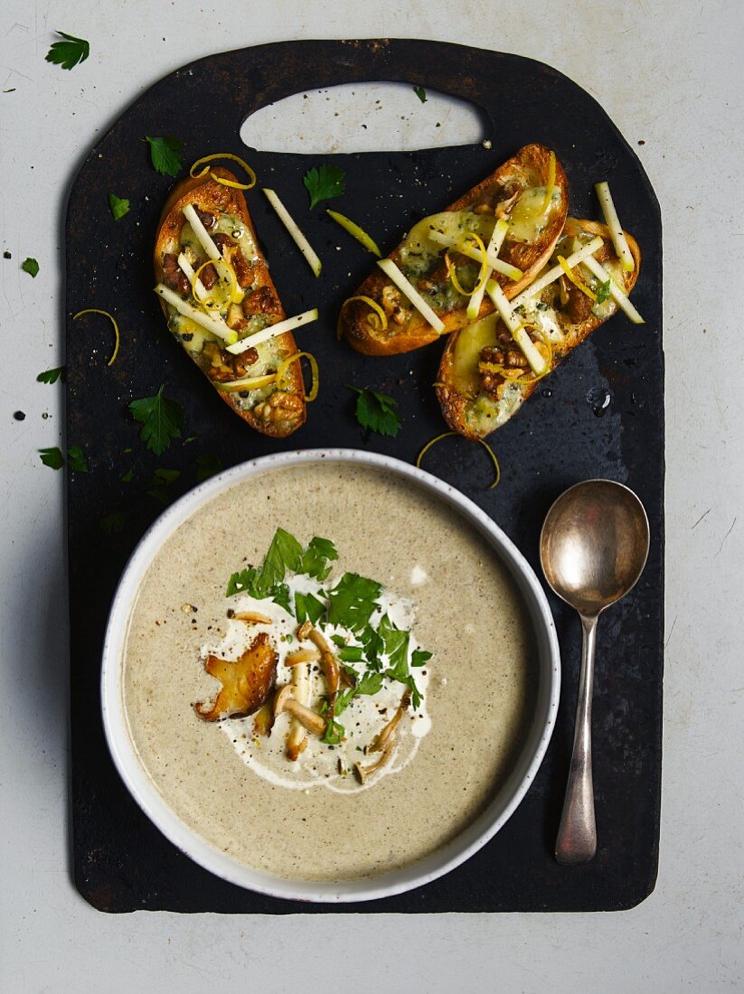 Mushroom soup and crostini topped with mushrooms