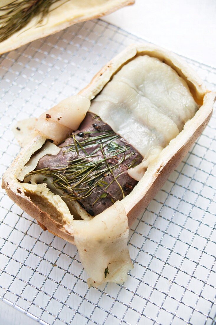 Saddle of venison in a salt dough with pine needles