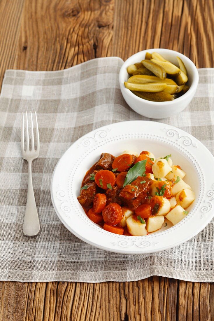 Beef stew with potato gnocchi and pickled gherkins