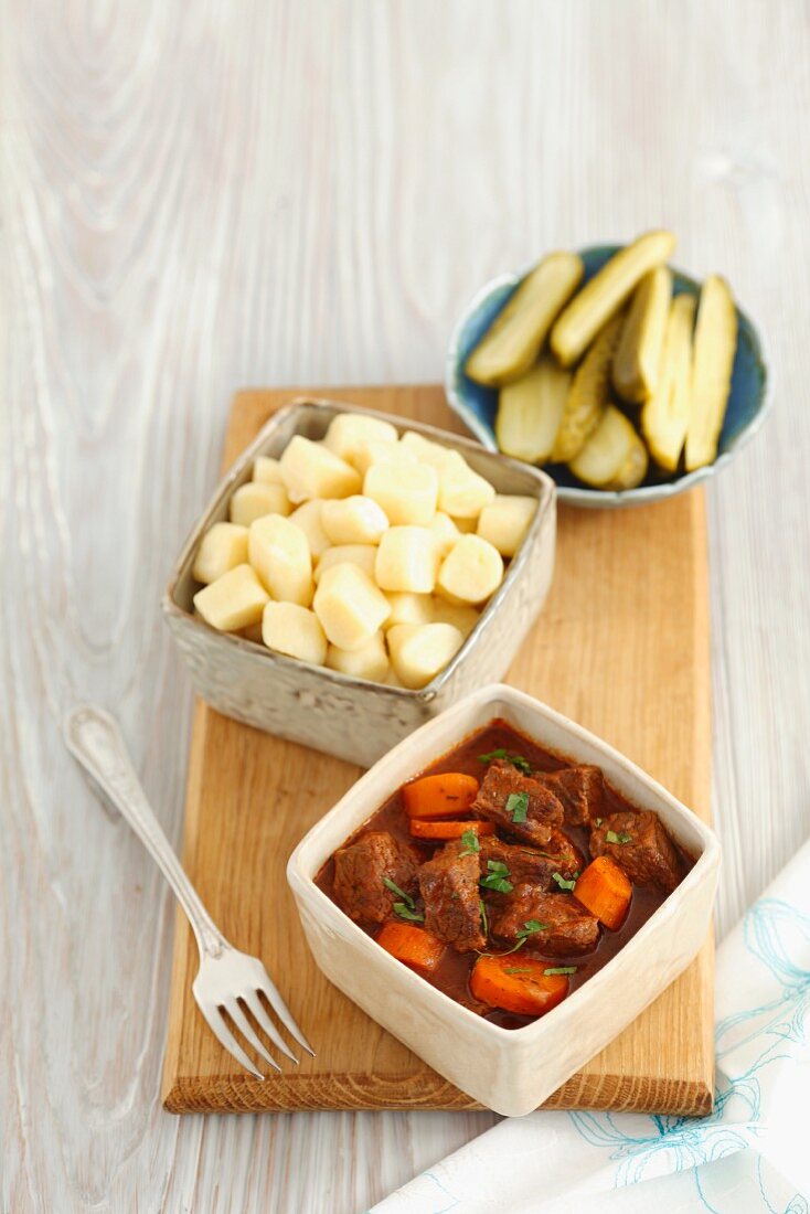 Beef stew with carrots, potato gnocchi and pickled gherkins