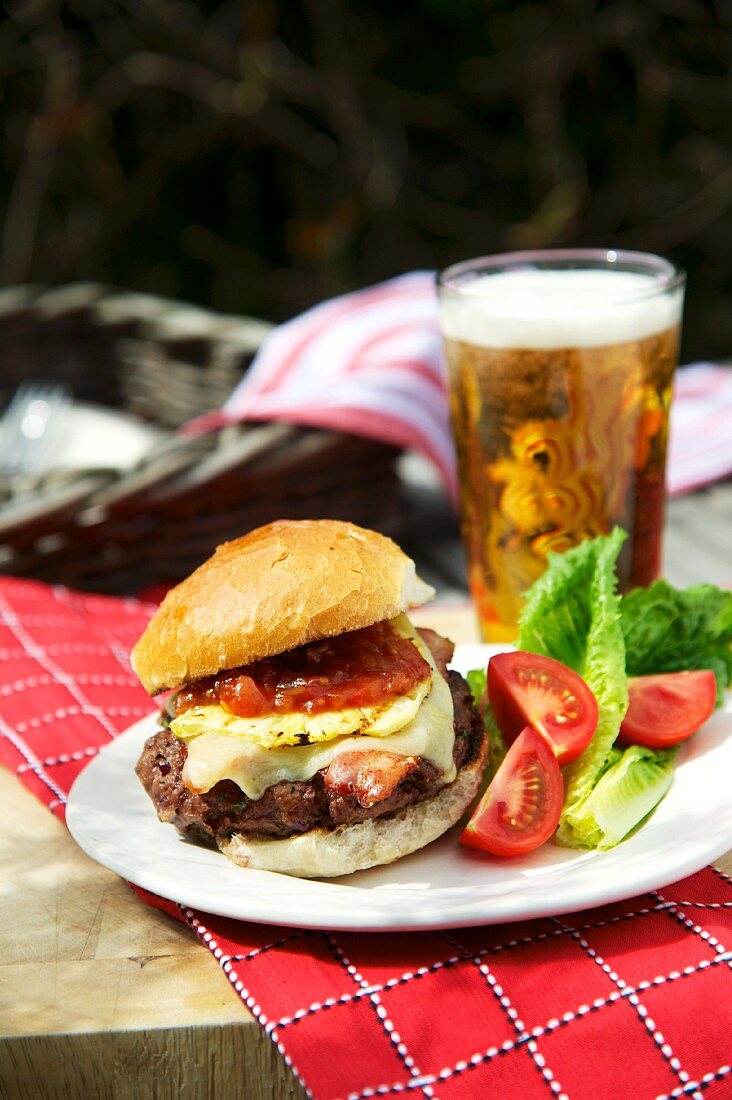 Cheeseburger with tomatoes and beer