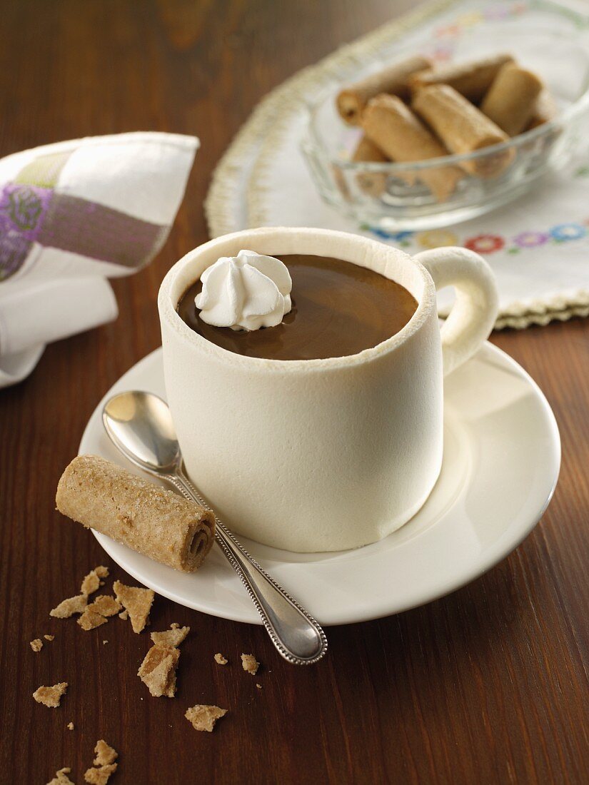 A coffee cup muffin with wafer rolls