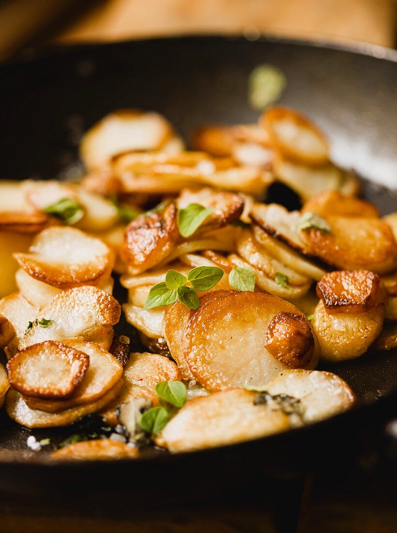 Fried potatoes in a frying pan