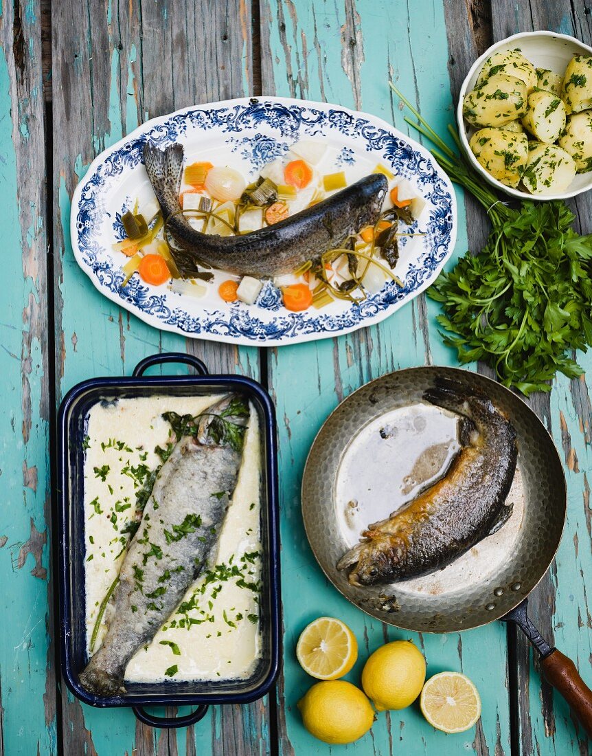Three different trout dishes with parsley potatoes