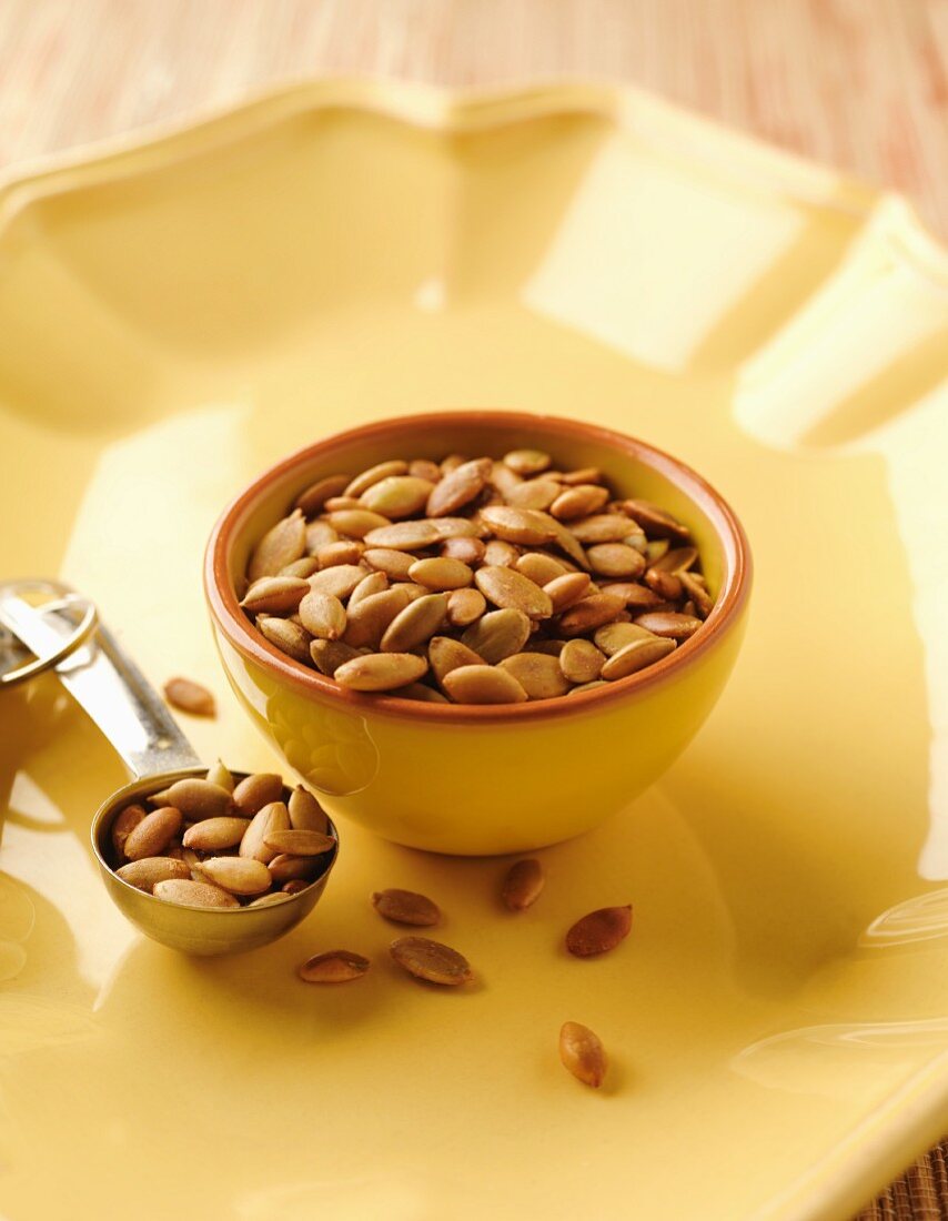 A Tablespoon and Bowl of Pepitas