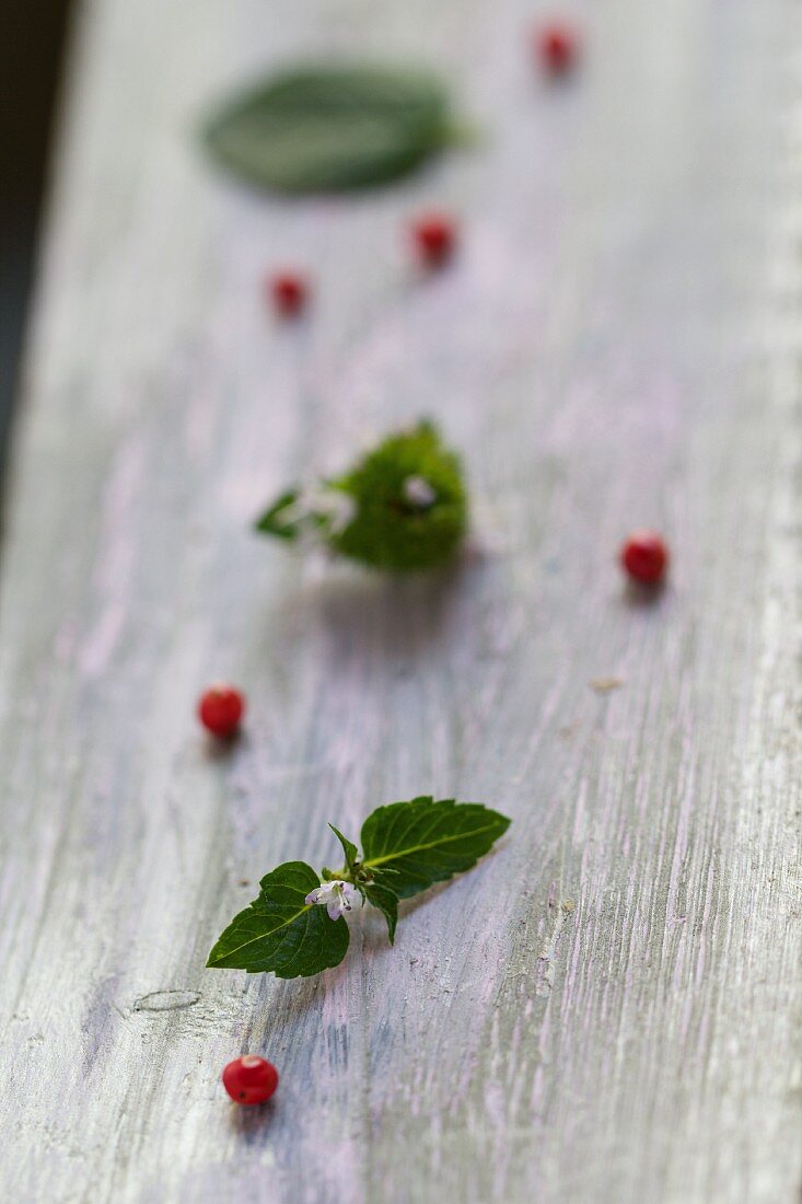 Pink peppercorns on a wooden board