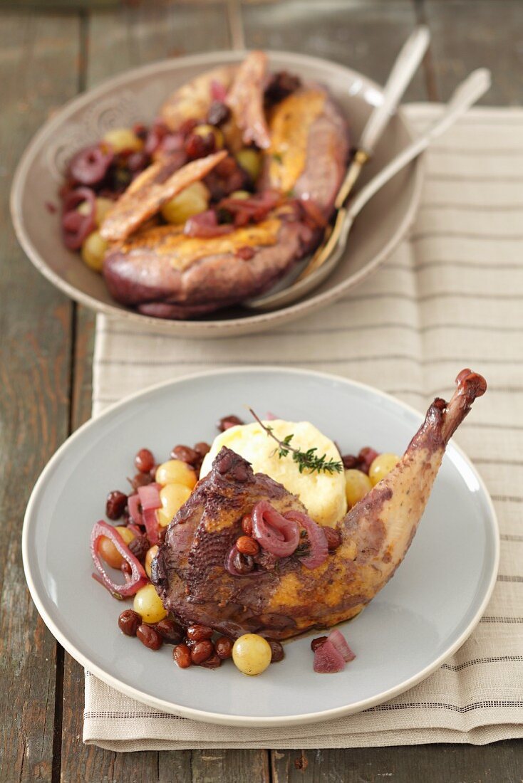 Partridge braised in red wine with grapes, raisins, onions and polenta