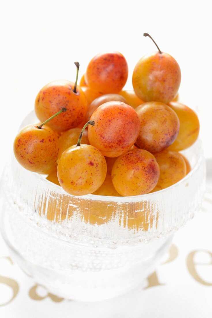 Mirabelle plums in a glass bowl