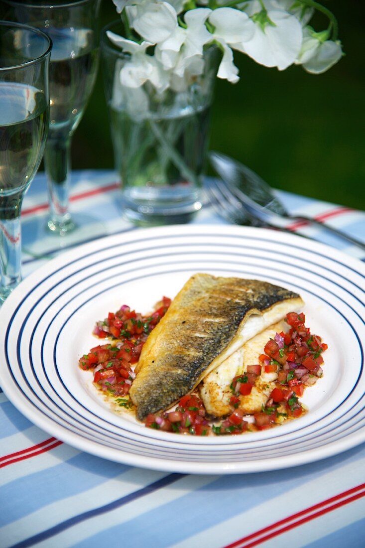 Sea bass on a bed of tomato salsa