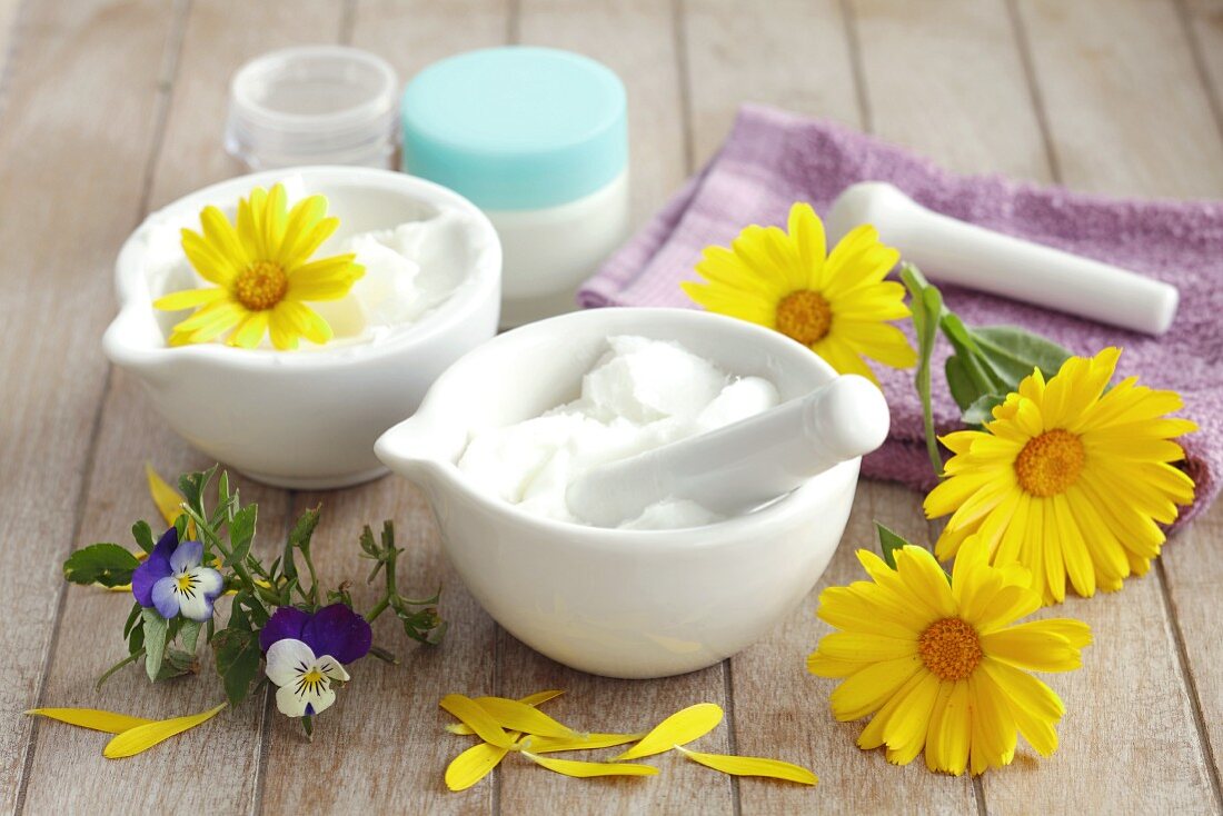 Home-made salve with violets and marigolds