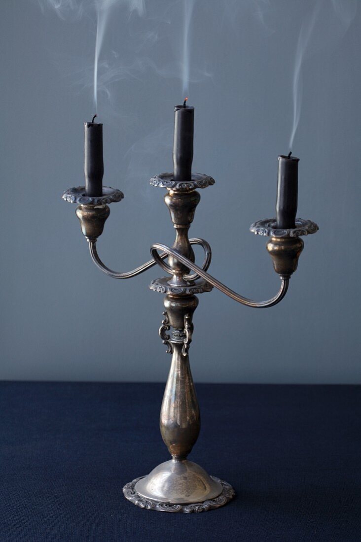 A Candelabra with Three Dark Candles Just blown Out