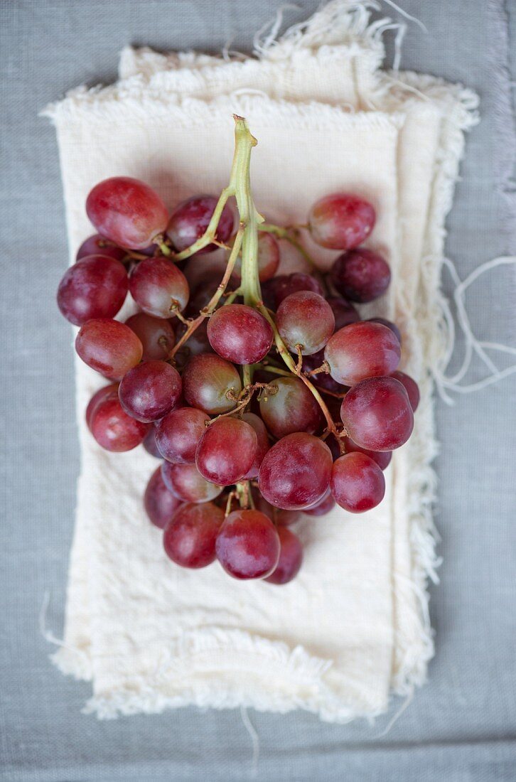 Red grapes on pieces of linen