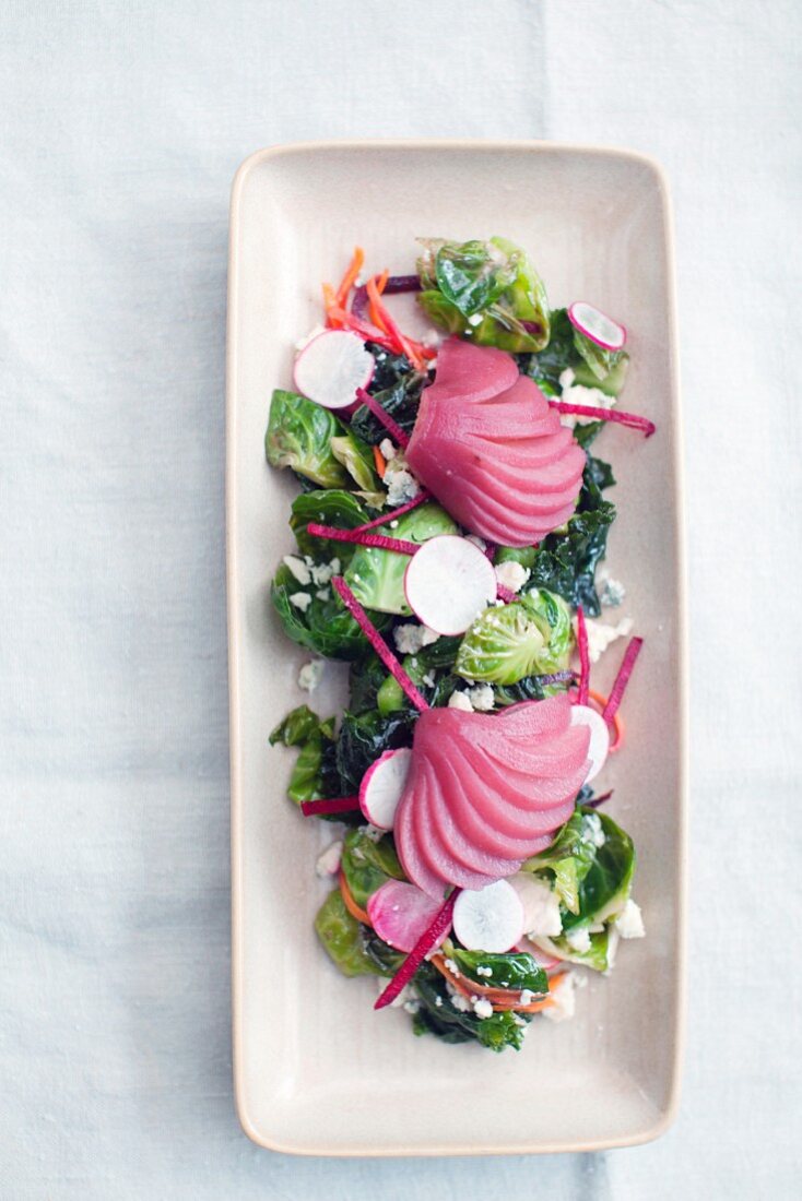 Brussels sprout salad with goat's cheese and poached pears