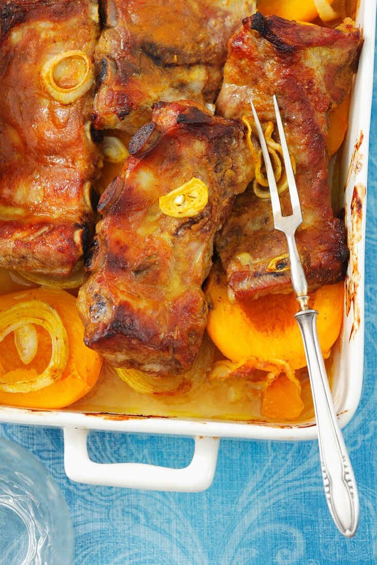 Pork ribs with onions and peaches