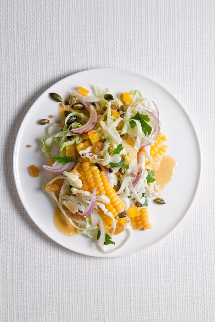 Cabbage and sweetcorn salad with raisins and pumpkin seeds