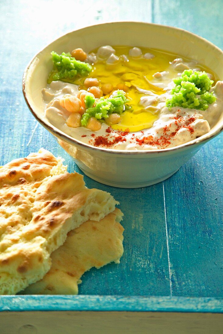 Houmous and tahini with olive oil, served with pita bread