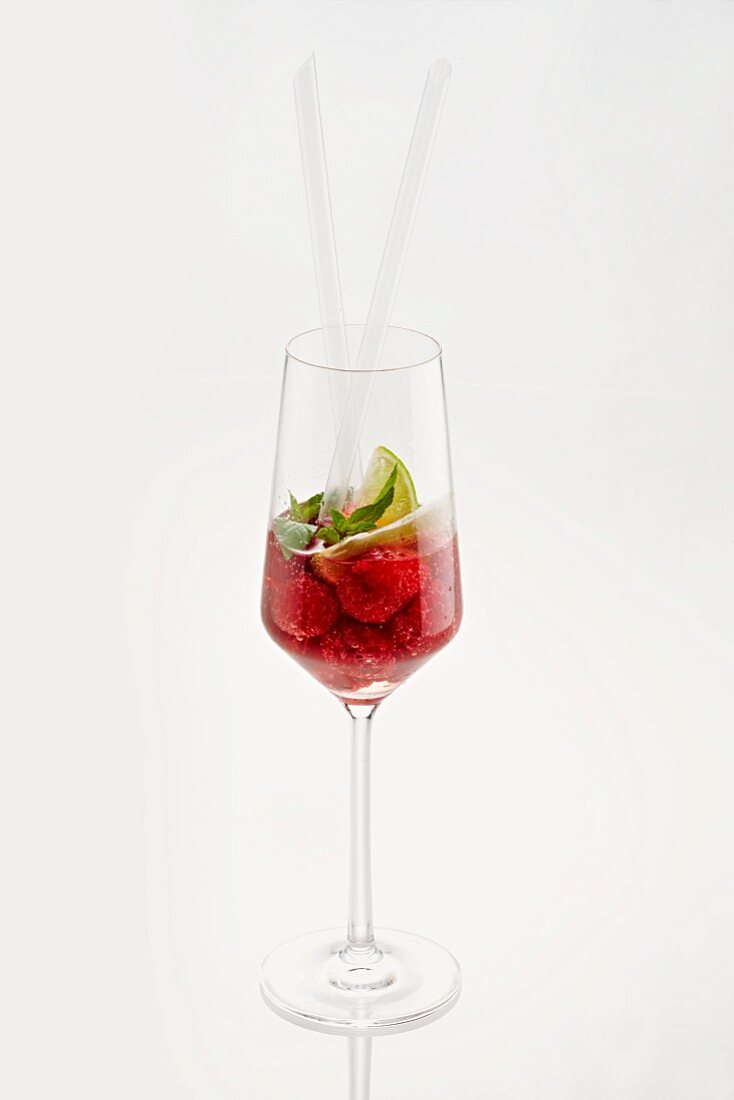Raspberry cocktail with limes and mint